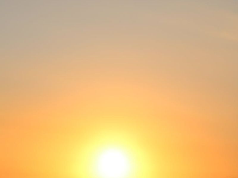 Person moving gracefully in a bright, open space.